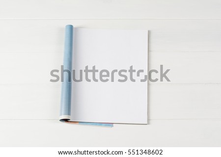 Mock-up magazine or catalog on wooden table. Blank page or notepad on wood background. Blank page or notepad for mockups or simulations.