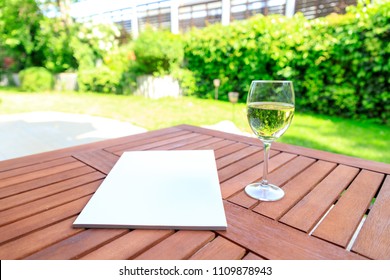 Mockup Of A Magazine Cover On A Wooden Table In The Garden In Summer.