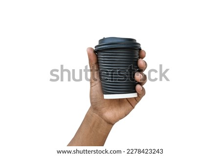 mockup of male hand holding black coffee paper cup. clipping path.