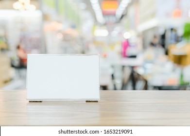 Mockup Menu Frame On Counter Bar Table , Stand For Booklets With Advertising Promotion Recommended Menu On Blurred Interior Restaurant Or Coffee Shop Background Clipping Path On Acrylic Frame