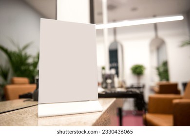 Mockup of a menu frame standing on a table in a bright room. Restaurant. Beauty saloon. Bar. Place for text.