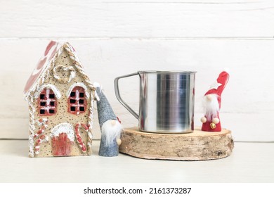 Mockup Of A Metal Camping Mug. A Metal Mug On A Light Background With Holiday Symbols.