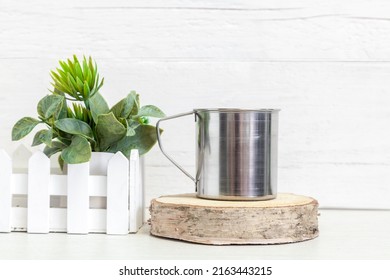 Mockup Of A Metal Camping Mug. Metal Mug On A Light Background.