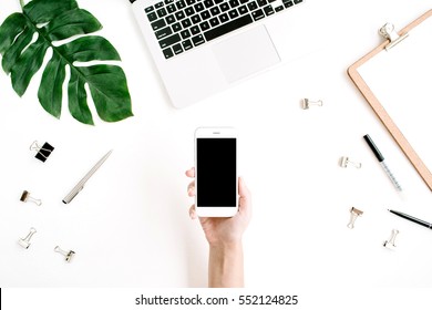 Mockup Of Mobile Phone With Blank Copy Space Screen In Female Hand. Flat Lay, Top View Workspace