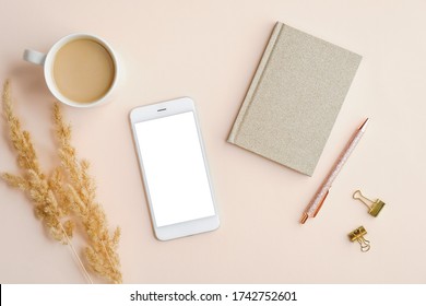 Mockup Of Mobile Phone With Blank  Screen On Home Office Desk Table. Flat Lay, Top View.