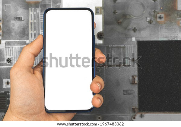 Mockup mobile phone on a\
background of computer and parts, repair concept template with copy\
space
