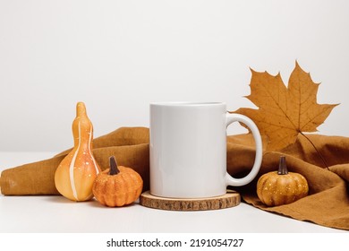 Mockup Mug With Autumn Maple Leaf And Pumpkin Decoration. Mug For Autumn Design, Text And Logo