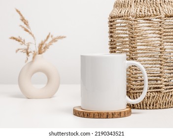 Mockup Mug Or Coffee Cup With Home Decor At The Background. White Mug For Logo, Text And Design Template. Aesthetic Minimal Concept
