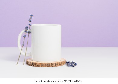 Mockup mug on wooden coaster at purple background, blank cup for logo or design - Shutterstock ID 2121354653