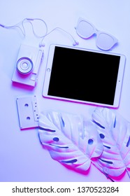 Mockup on tablet on mint background with pink leaf, cassette and doughnut