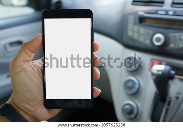 Download Mockup Phone Hand On Blurred Car Stock Photo Edit Now 1057625258 PSD Mockup Templates