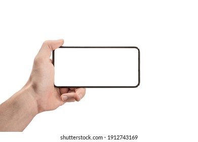 Mockup Phone Horizontal. Hand Holding The Black Smartphone And Modern Frameless Design. Isolated Man Left Hand Holding Black Horizontal Cellphone Phone. Watch Tv Streaming Video Movies Online