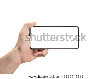 mockup phone horizontal. Hand Holding The Black Smartphone and Modern Frameless Design. Isolated man left hand holding black horizontal cellphone phone. watch tv streaming video movies online