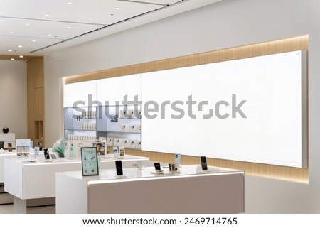 Mockup rectangle LED screen on the wall of mobile shop in shopping mall, Empty space for insert media advertisement about mobile phone, promotion or special price in modern design. Marketing strategy
