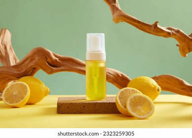 Mockup scene for advertising cosmetic of lemon extract with yellow bottle with fresh lemon slices and dry twigs on green background. Lemons are a good source of vitamin C and antioxidants - Powered by Shutterstock