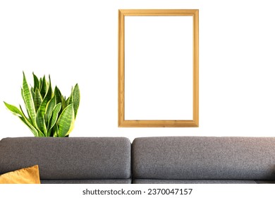 a mockup of a sofa in a living room with a plant in the background with a vertical wooden frame for photo - Shutterstock ID 2370047157