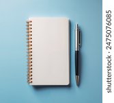 Mockup of a spiral notebook and pen