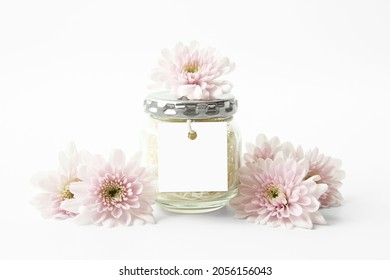 Mockup Square Hang Tag On A Jar With Pink Flowers. Feminine Tag Mockup. Favor Tag, Gift Tag. Party, Wedding. 