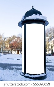 Mockup street advertising or information column stand on sidewalk at winter