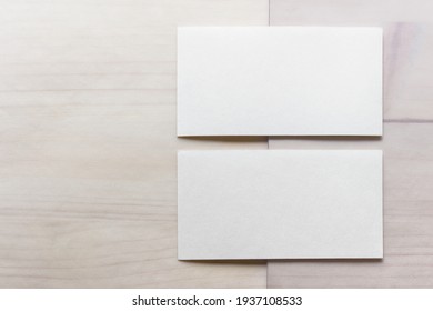 Mockup Template With Two Blank Business Cards On Wooden Background.