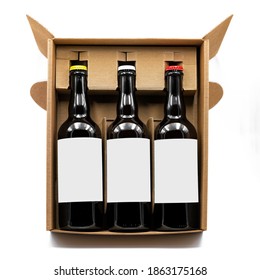 Mockup Of Three Beer Bottles Inside A Brown Cardboard Box