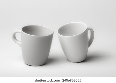 Mockup of a two different coffee cups, isolated, on a plain background, ready to overlay designs or logos for merchandising