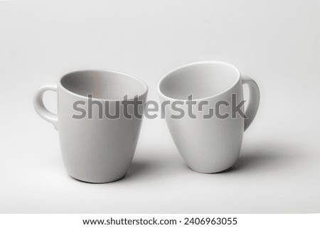 Mockup of a two different coffee cups, isolated, on a plain background, ready to overlay designs or logos for merchandising