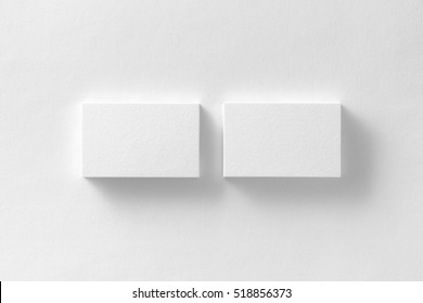 Mockup Of Two Horizontal Business Cards Stacks At White Textured Paper Background.