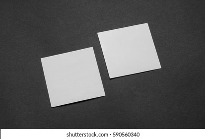 Mock-up Of The Two Square Business Cards Are On A Black Paper