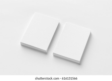 Mockup Of Two Vertical Business Cards At White Textured Paper Background.