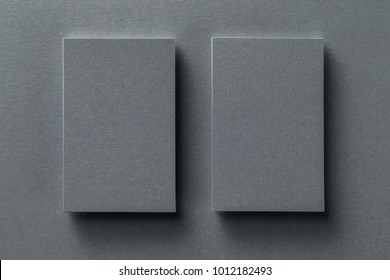 Mockup Of Two Vertical Silver Business Card Stacks At Textured Designer Paper Background.