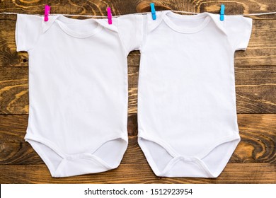 Mockup Of Two White Baby Bodysuit Shirt