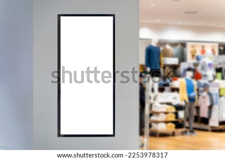 Mockup vertical advertising signboard on wall at front of clothing shop, empty space for insert your text, announcement or advertisement promotion