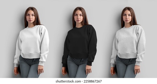 Mockup of a white, black, heather crop sweatshirt on a girl, women's shirt for design, isolated on a wall background, front view. Fashion casual clothes template for advertising,print. Long sleeve set