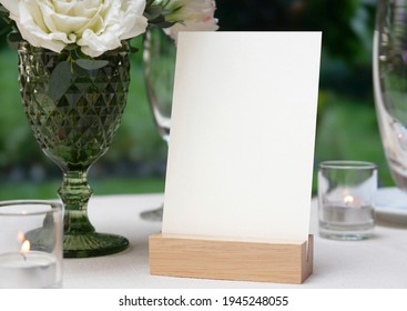 Mockup White Blank Space Card, For Greeting, Table Number, Wedding Invitation Template On Wedding Table Setting Background. With Clipping Path