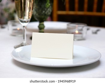 Mockup White Blank Space Card, For Name Place, Folded, Greeting, Invitation On Wedding Table Setting Background. With Clipping Path