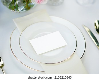 Mockup White Blank Space Card, For Name Place, Folded, Greeting, Invitation On Wedding Table Setting Background. With Clipping Path