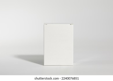 Mockup of a white box of parapharmacy product, standing, includes tracing