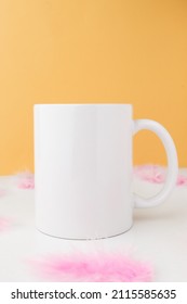 Mockup Of A White Coffee Mug On A Colorful Background With Decor. Template With Empty Space For Logo And Design, Advertising, Minimal Composition.