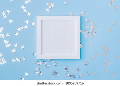 Mockup White Frame With Christmas Decorationon A Blue Background