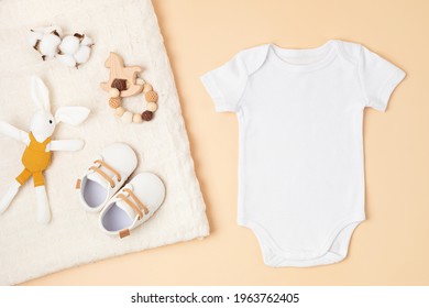 Mockup Of White Infant Bodysuit Made Of Organic Cotton With Eco Friendly Baby Accessories. Onesie Template For Brand, Logo, Advertising. Flat Lay, Top View