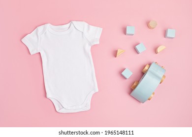 Mockup Of White Infant Bodysuit Made Of Organic Cotton With Eco Friendly Baby Toys