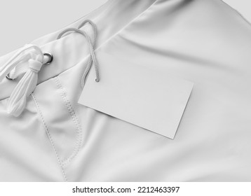 Mockup Of White Men's Trunks For Swimming, Boxers Close-up With A Tag, Label, For Branding, Design, Pattern, Advertising. Summer Swimwear Template, Subject Isolated On Background.