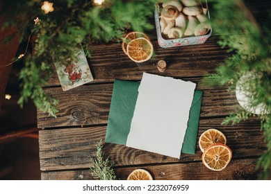 Mockup of white sheet of paper on the table with christmas decor, christmas letter mockup, christmas party invitation