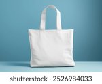 mockup of white tote bag on soft pastel blue background