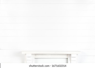 Mock-up of a white wall with a mantelpiece for your design - a light background to show your work