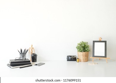 Mockup workspace desk and copy space books,plant and coffee on white desk. - Shutterstock ID 1176099151
