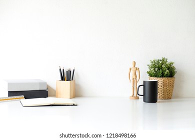 Mockup workspace desk and copy space books,plant and coffee on white desk. - Shutterstock ID 1218498166