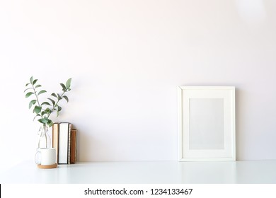 Mockup Workspace Desk And Copy Space Books,plant And Coffee On White Desk.