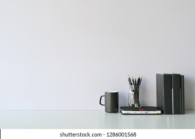 Mockup workspace desk and copy space books, coffee and pencil on white desk. - Powered by Shutterstock